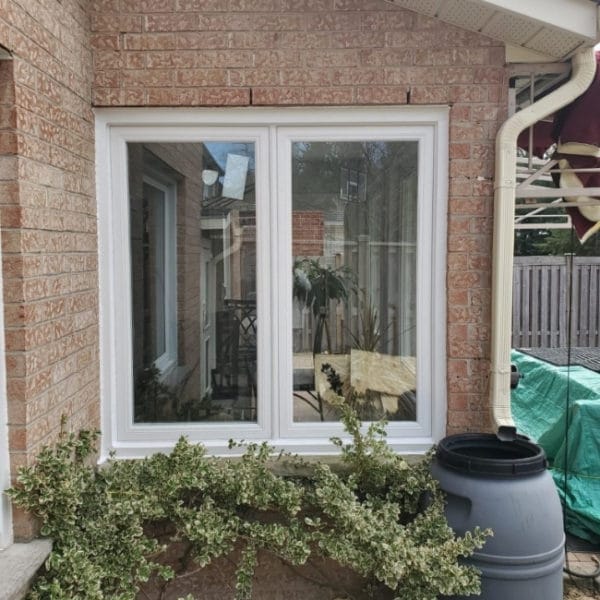 Image depicts a newly installed vinyl window from our project in Maple.