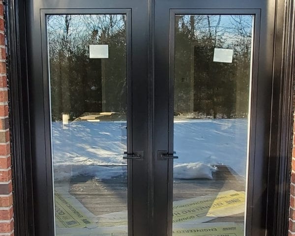 Image depicts a new, modern patio door from our windows and doors Oakville project.