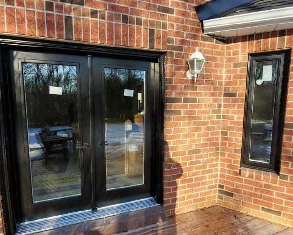 Image depicts a new, modern entry door from our windows and doors Oakville project.