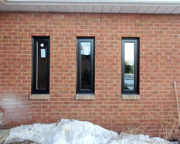 Image depicts three narrow vinyl windows from our windows and doors Oakville project.