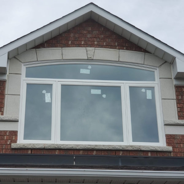 Image depicts newly installed white picture windows in a Whitby home.