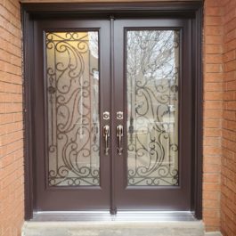 brown entry door with wrought iron detailing