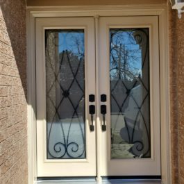 cream double entry front door iron design