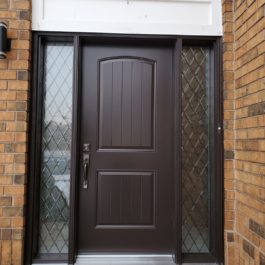 modern brown entry door with double sidelites