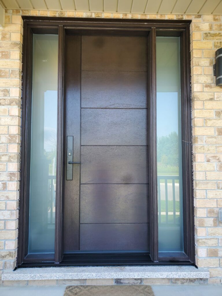 Brown fiberglass door with two sidelites